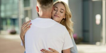 Man picking up his wife near the airport building