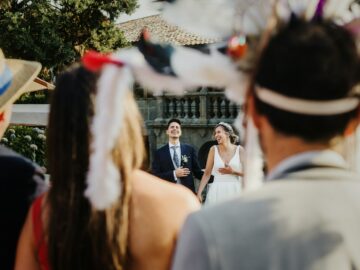 Couple laughing at a wedding with disguised guests