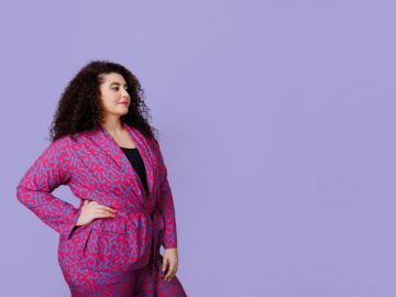 A young woman with a plus size figure with an Afro hairstyle