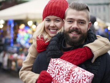 Happy couple with big gift box