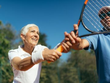 Mature Woman Playing Tennis