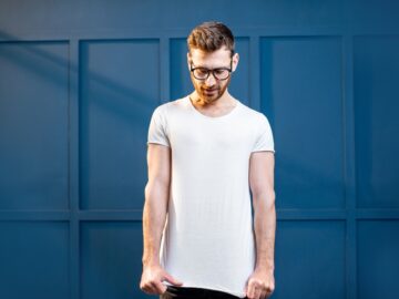 Man in white t-shirt on the blue background